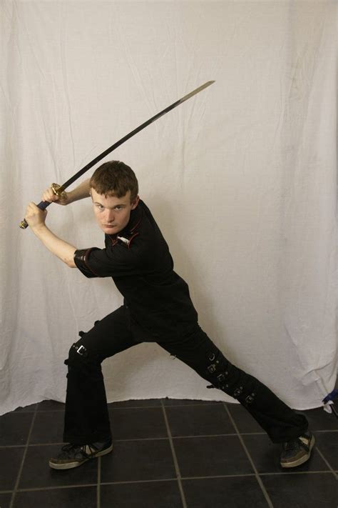 Holding a sword pose. Fight masters worked with a grisly assortment of deadly weapons. The majority of training was dedicated to fencing with the longsword, or the sword and buckler (a style of combat involving holding ... 