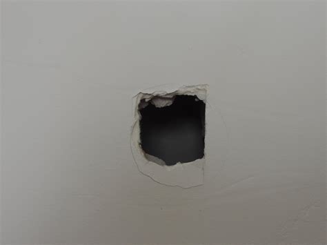 Hole in drywall. Step 2: Sand the edged of the hole with sandpaper. The surface must be entirely smooth in order for the result to look as good as new. Step 3: Apply the self-adhesive patch with the hole as ... 