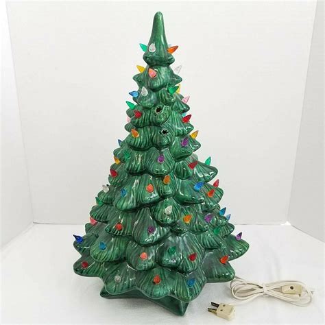 This Vintage Holland Mold 9” Ceramic Lighted Christmas Tree with Attached Base is the perfect addition to your holiday decor. The tree, handcrafted and made of ceramic, features multicolor lights that give a festive touch to your home.. 