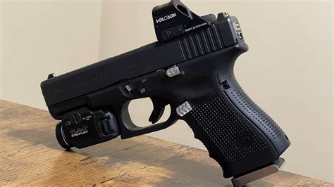 The Holosun 507C red dot sight is compatible with Glock handguns and works best with suppressor height sights to co-witness with the red dot. 1. Can I use standard height sights with a Holosun 507C on my Glock? No, it is recommended to use suppressor height sights for proper co-witnessing with the Holosun 507C.