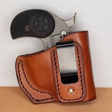 This premium leather driving holster designed for the Stinger and Stinger RS is built for protection against car hijackings. It's also a very popular cross draw concealment holster with a quick release thumb break. Available in black. Fits belts up to 1 3/4" in width. For left-hand orientation, use SKU: BAH-DT-S30-BB-L-BT. Style. Stinger. Color.. 