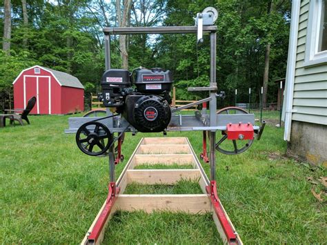  This is the band sawmill I built in 2018. I used rectangular tube and angle iron for the trailer, motorcycle wheels as band wheels and 420 ccm industrial gas... . 