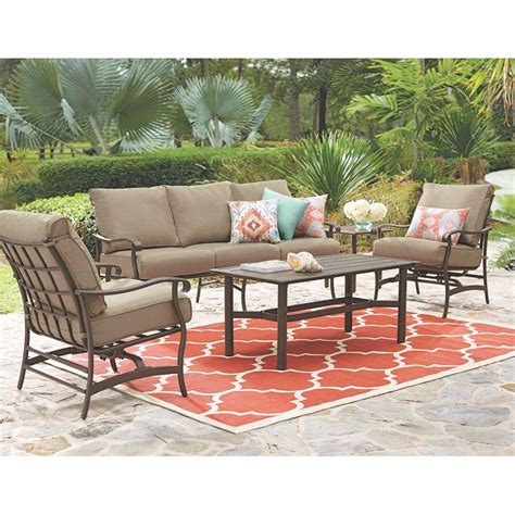 The Home Decorations Collection Oakshire Park 9-Piece Aluminum Outdoor Dining Set with Sunbrella Henna Red Cushions is a beautiful onsomble that will dress up any outdoor deck, patio, or even a good sized screened in room.. 