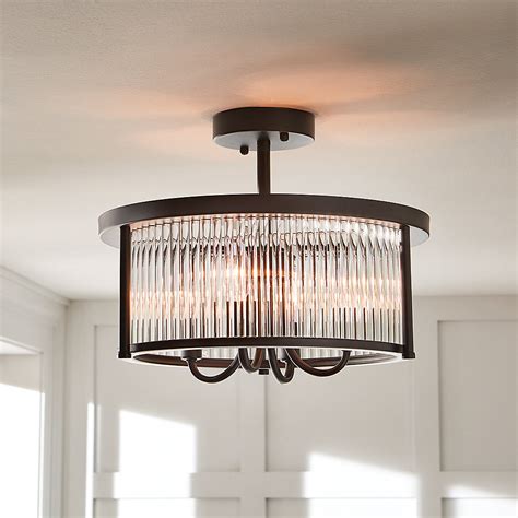Influenced by a mid-20th century vintage industrial design, the Knollwood lighting collection has clear glass shades that will perfectly highlight the classic Edison bulb. The linear 6-light antique bronze chandelier offers transitional style with timeless appeal..