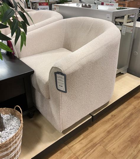 This single armchair brings a minimalist accent and enticing swivel feature to any corner. Made in the USA, it has a solid and engineered wood frame and a barely visible, solid wood base in a black finish. Wrapped in antimicrobial upholstery, its foam-filled back and seat cushions provide extra support. This chair boasts a classic barrel shape for a cozy feel. Place it in your bedroom reading .... 