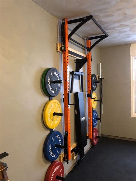 Home gym with squat rack. Dec 10, 2019 · Ritfit Multi-Functional Folding Squat Rack for Home Gym, 2.36'' x 2.36'' Wall Mounted Squat Rack with Attachments - Space Saving Squat Power Rack… 6 offers from $299.99 PRx Performance Profile Squat Rack 2"x3" with Kipping, Pull Up or Multi-Grip Pull-up Bars MADE IN USA Wall Mounted Home Gym Folding Fitness Equipment Power Rack Shark Tank ... 