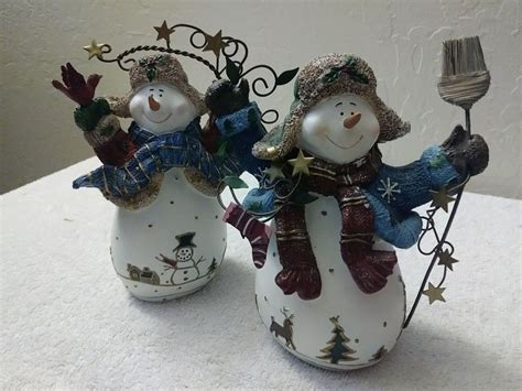 Home Interiors Skating Snowman Ornaments Set of 3 - Each in a different pose Sparkly Pink and Purple Couples Each one has a silver string for hanging Use as tree ornaments or as table top figurines They stand roughly 3" tall No chips or cracks. Home Interiors Tags are a bit crumpled. Sweet little figures! Thanks for shopping Little Cabin …