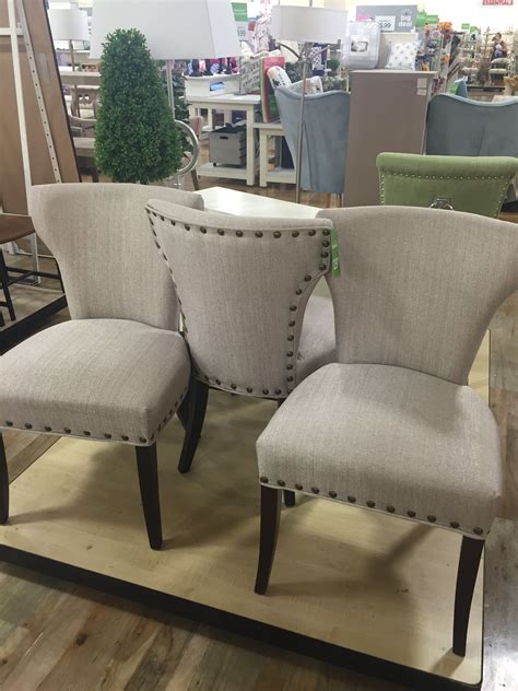Description. Rooted in English country styling, these elegant dining chairs will elevate your home with the charms of a fine contemporary estate. Each piece features comfortable cushioned backs, handsome nailhead trim and easy care woven fabric. Complete with golden oak finish legs, this set of two chairs is the timeless addition to an eat-in .... 