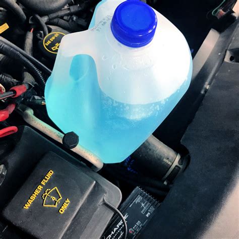 1. Locate the Windshield Washer fluid container in your car. 2. Place a Funnel on the opening, and pour in the following: • 1 Quart: Rubbing Alcohol. • 1 Cup: Water. • 2 Tablespoons: Liquid .... 