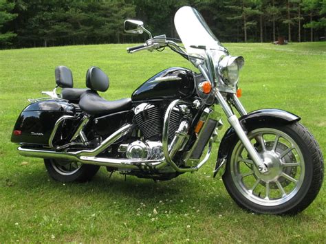 The 2020 Honda Shadow Phantom decided to forego chrome and color in favor of smooth black accents and trim, as evidenced by spoked wheels, black rims, bobbed fenders, matte black accents. With this bike, even the engine is black. That 745cc V-twin engine powering the Shadow Phantom received the same treatment as the rest of the …. 