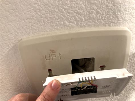 With the faceplate removed, the next step in uninstalling your Honeywell smart thermostat is disconnecting the wires from the thermostat base. Follow these steps to safely disconnect the wires: 1. Identify the Wiring Terminal Blocks: Look for the wiring terminal blocks on the thermostat base.. 