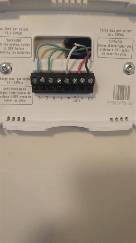 Remove the wall screws holding up the thermostat