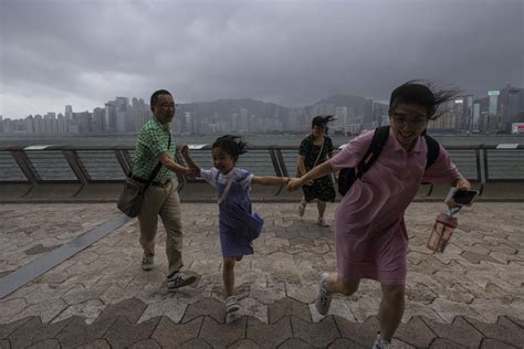 Hong Kong schools and stock market are shuttered as Typhoon Talim sweeps to the south, toward China