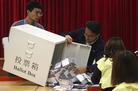 Hong Kong to cut elected council seats in blow to democracy