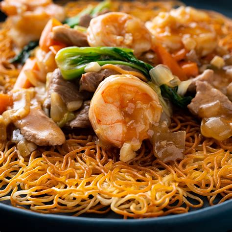 Hong kong noodles. Nov 30, 2021 · How to make the sauce or gravy. Heat the oil in a wok. Saute garlic until brown, and add the meat and cook for 2-3 minutes. Add the vegetable and cook for another 3-4 minutes. Add the broth and sauce, and let it simmer; then pour the cornstarch to thicken the sauce. Serve it over crispy noodles. 