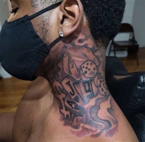 Neck tattoos for men, are a distinctive form of self-expression, demanding artistic ingenuity and technical prowess. Crafting intricate designs, geometric patterns, or symbolic images like birds and roses requires precision and mastery, particularly given the neck's complex curvature and sensitive skin.