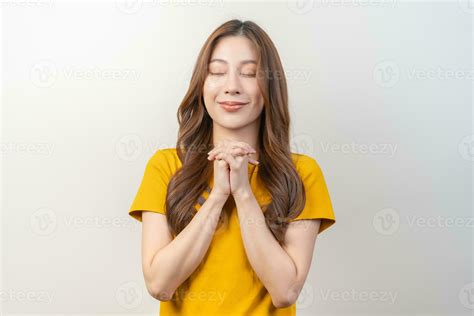 Hopeful make wish, calm asian young woman belief, hand in prayer …