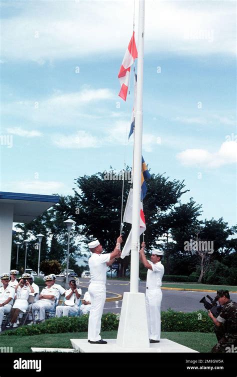 Hospital corpsmen lower pennants during the closing ceremony …