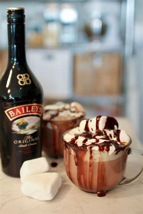 Hot chocolate and baileys. Add the room temperature Baileys to the bowl with the remainder of the chocolate and use a hand mixer to combine until smooth. Add sugar and cocoa powder to Baileys and chocolate mixture and combine. Once the chocolate has set, carefully remove the half spheres from the molds and place them face-up on a plate. 