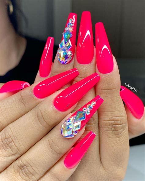 Hot pink coffin nails designs. Source: @starla.bright. • hot pink coffin nails with glitter. Coffin-shaped pink acrylic nails will emphasize the elongated shape of your nail plate. Those girls who have strong natural nails can make them look even more expressive if they use some luxurious glitter and apply it diagonally on one of the nails. 