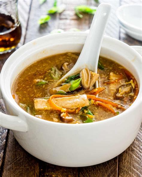 Hot sour soup near me. Step 2 In a large pot over medium heat, heat 2 tablespoons oil. Add garlic, ginger, green onions, chile, and salt. Stir until fragrant, about 1 minute. Stir in Sriracha, sugar, yuba, wood ear, and ... 