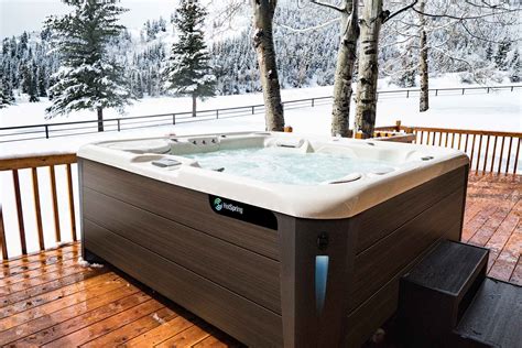 Hot spring hot tubs. The Envoy Jet System offers an incredible 55 jets that relieve tension in targeted areas including your back, neck, shoulders and calves. Deeply sculpted to wrap you in relaxing comfort and a full-body experience. Upright to support your back plus extra room to change your position for more hydrotherapy options. 
