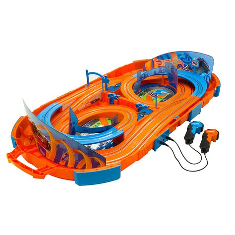 Hot Wheels R/C 1:64 mini cars can be driven on the table or floor and come with an adapter to easily guide a car onto any iconic Hot Wheels orange track (sold separately). Each car in the assortment makes for an awesome gift for the adventurous kid, 5 years old and older, or any R/C thrill seeker.. 