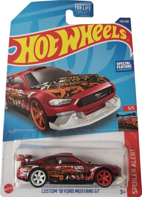 2022 Super Treasure Hunts. The 2022 Super Treasure Hunt set has premium vehicles with Spectraflame paint, Real Rider wheels, and a “TH” graphic. They are upgraded versions of cars within other series. Behind the car, on the blister card, there may be a circle & flame emblem.. 