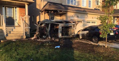 House engulfed in flames after car crashes into it