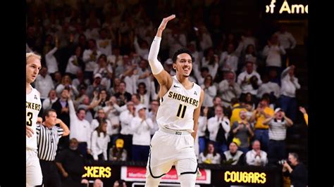 Houston wichita state basketball. Wichita State University’s Kenny Pohto, left, and James Rojas, center, and Xavier Bell, right, cheer after Rojas was fouled and made a basket against the University of Houston during their... 