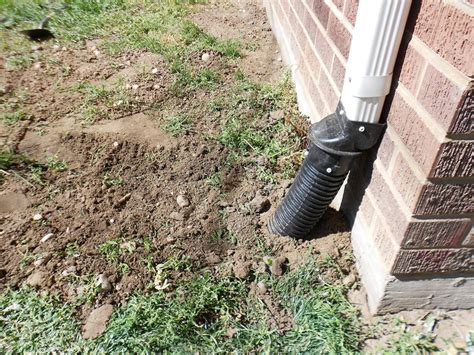 How Far Should You Bury Downspouts From The House?