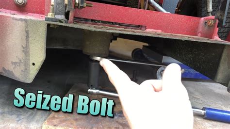 How To Break Loose Seized Mower Blade Bolt - YouTube