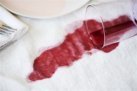 How do i remove wine stains. Simply pour a liberal amount of soda over the stain, then cover the area completely in salt (unrefined salt works best.) Gently press the salt into the fabric ... 
