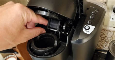 To unclog them, take a paperclip or needle and carefully insert it into the needle openings, located in the K-cup holder area. Gently move the paperclip or needle around to dislodge any debris that may be causing the clog. Be cautious not to push too hard or damage the needles. Step 4: Reassemble your Keurig.. 