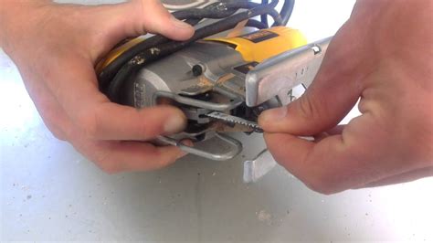 How do you change the blade on a Dewalt cordless jigsaw?