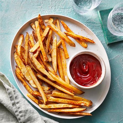 How do you cook fries. Oct 25, 2023 · Soak potato strips in a large bowl of water for about 30 minutes. Pat with paper towels until thoroughly dry. Heat oil in a deep-fryer or large saucepan to 275 degrees F (135 degrees C). Gently add potatoes to the hot oil and fry for about 5 minutes, stirring and flipping the potatoes occasionally. 