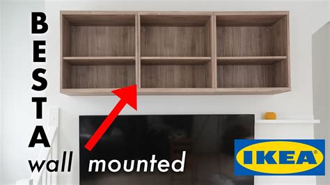 How do you mount an Ikea Besta unit to the wall?