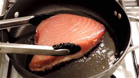 How do you pan fry tuna steaks. Coat the hot skillet with olive oil and set the tuna steak in the pan. Do not move for at least 2 minutes to achieve a golden color or crust. Flip and cook 2 ... 