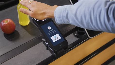 How does Whole Foods' new palm reader payment system work?