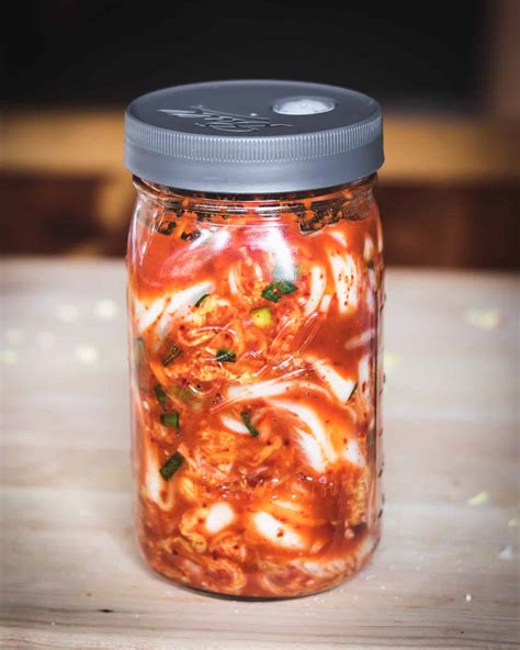 How is kimchi fermented