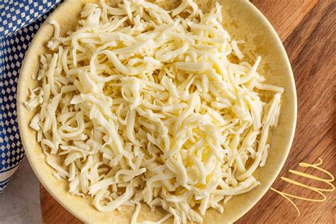How is shredded cheese made