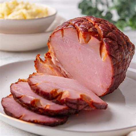 How is smoked ham made