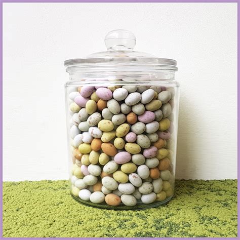 How many mini eggs in a jar answer. It pretty much says how much of the total volume of the jar is taken up my only the m&m’s. In this case, from the paper, it was 66.5%. This means that 33.5% is made up of air in between the m&m’s. So your final equation to figure out the number of m&m’s is: (VOLjar/VOLmm)*PackingFraction. 