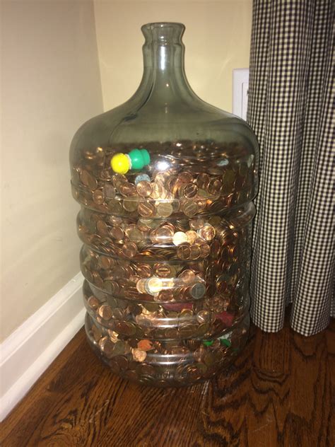 How many pennies does it take to fill up a 5 gallon water bottle? -