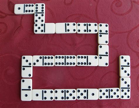 How much are domino. Remaining dominoes are termed "sleeping" tiles. The first person to play is that person holding the double-six, or failing that the double-five and so on. The tile played must be the double tile that permitted the player to take the first turn. If none of the players hold a double, then the tiles are reshuffled and re-drawn. 