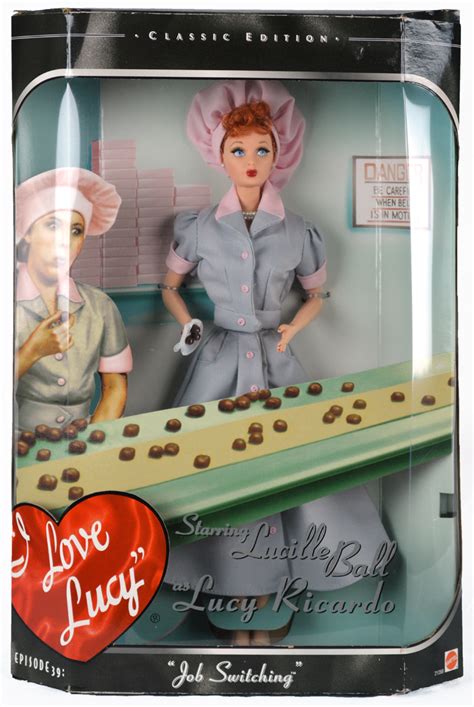 A vintage "I Love Lucy" doll by Barbie/Mattel from 1997. New in box. Box does show some shelf wear. This is from the I Love Lucy television show, "Lucy Does a Commercial, episode 30. Lucy is new in box and looks just like Lucille Ball. She has blue eyes with long eyelashes, red hair, and red.