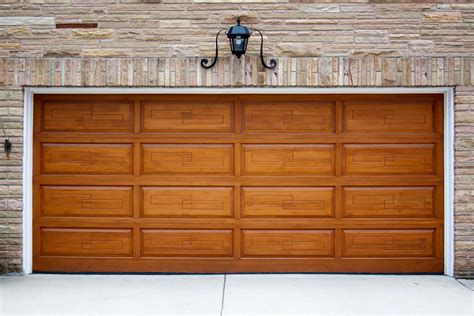 How much do garage doors cost. Usually, up-and-over garage doors consist of a solid panel. Then, upon opening, it tilts out of the way, lifts above your head, and stows below the garage roof when opened. In the UK, a supplied and fitted, single, standard-sized steel up-and-over garage door costs around £550. Alternatively, for a timber version, this would be about £1250. 