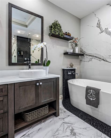 How much does it cost for a bathroom remodel. Location: Dallas, TX area Total cost: $23.5k (as of today). Cost breakdown for the bid here + a few progress pics. The job itself is about $18,500. We've spent about $4k on fixtures separately. $1k for a double vanity from Wayfair, $800 for a fancy toilet that requires electrical (Amazon), $700 for a freestanding tub (Amazon), ~$500 on fixtures and LED mirrors (Amazon). 