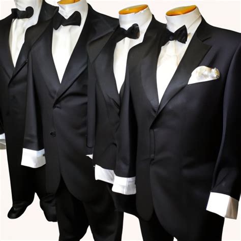 How much does it cost to rent a tux. Black Notch Lapel Tux. $159. $99 with $60 Perfect Fit® Program Perk. Joseph & Feiss. Boy's Black Suit. $81.99. Calvin Klein. Blue Suit. $299. 