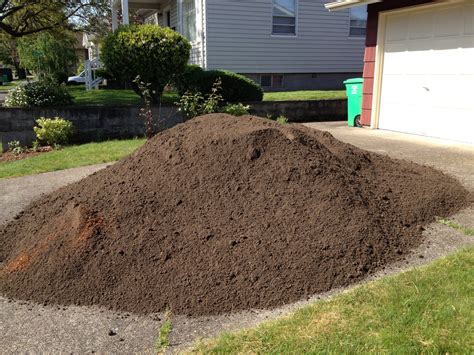How much is a yard of dirt. All depends on how wet the material is. In theory a full yard of top soil (less weight than fill) is around 1080 pounds, with a 150-250 driver, it would be within payload, if there isn't much else in the truck. If that is the case, 1/2 yard would be around 500 pounds. 